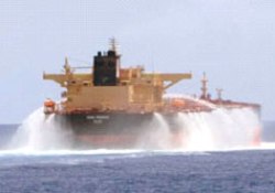 Vessel using water cannon to deter pirates, one of the many non-lethal methods available